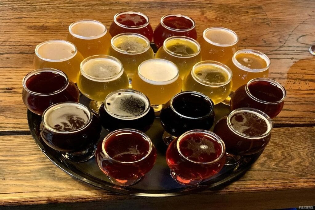 A flight of beers sits atop the bar at a Chicago brewery