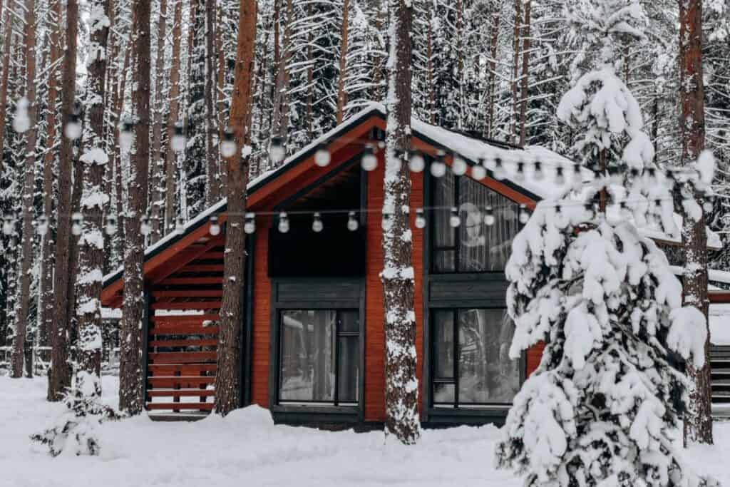 christmas lights cabin in the snow