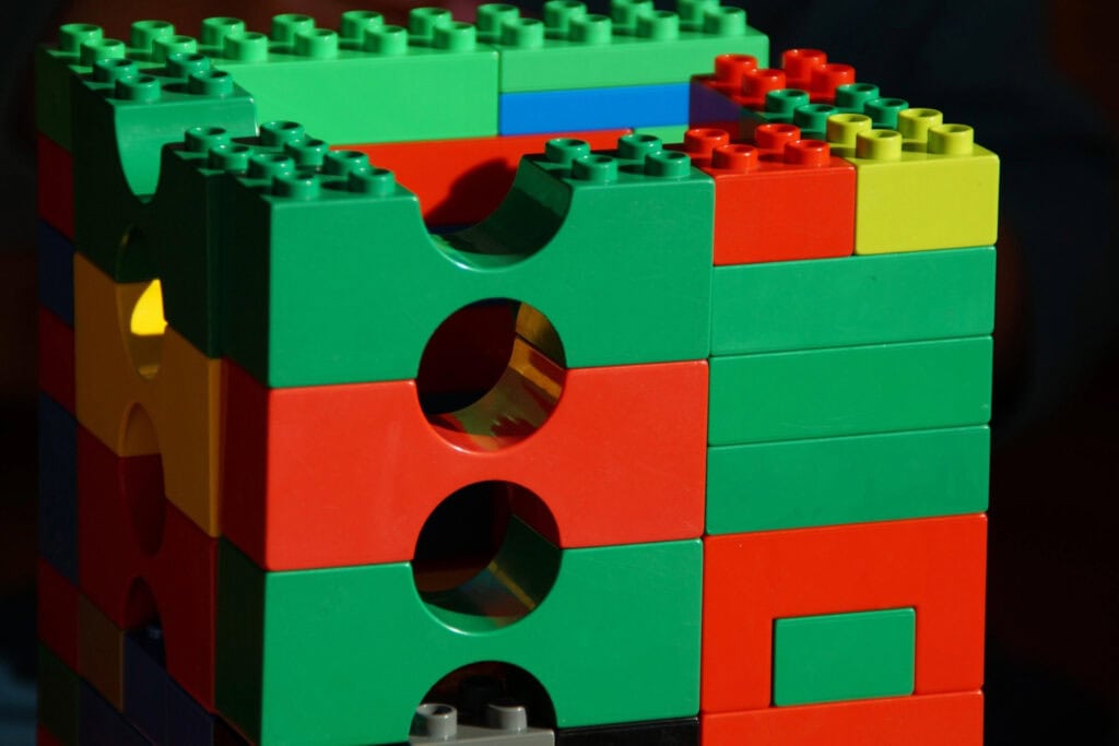 Classic Lego formation made of green, red and yellow Legos.