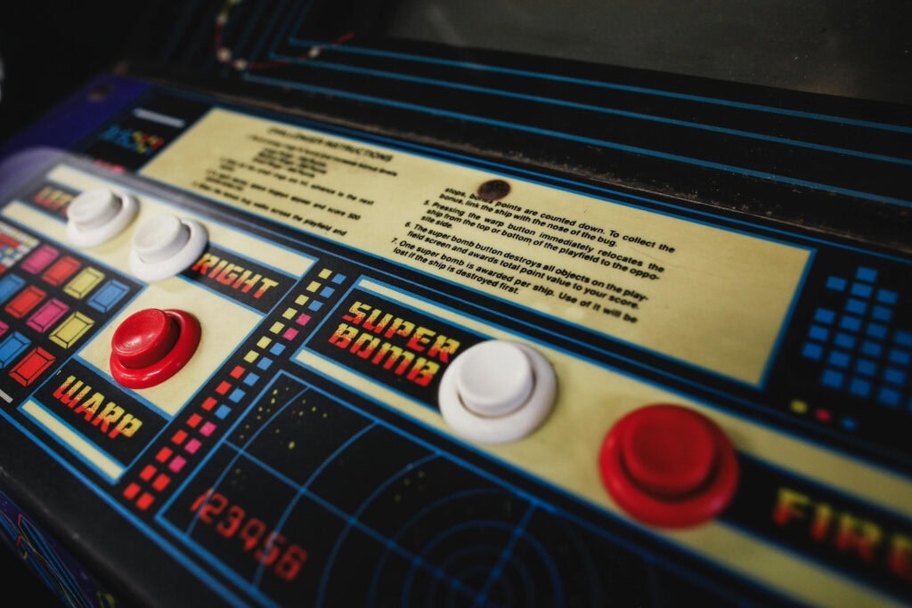 Close up of an old school arcade game console