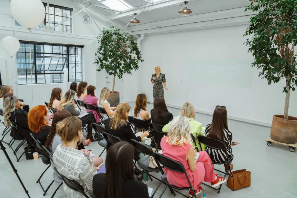 Professional networking gathering at modern Dallas courtyard corporate event venue