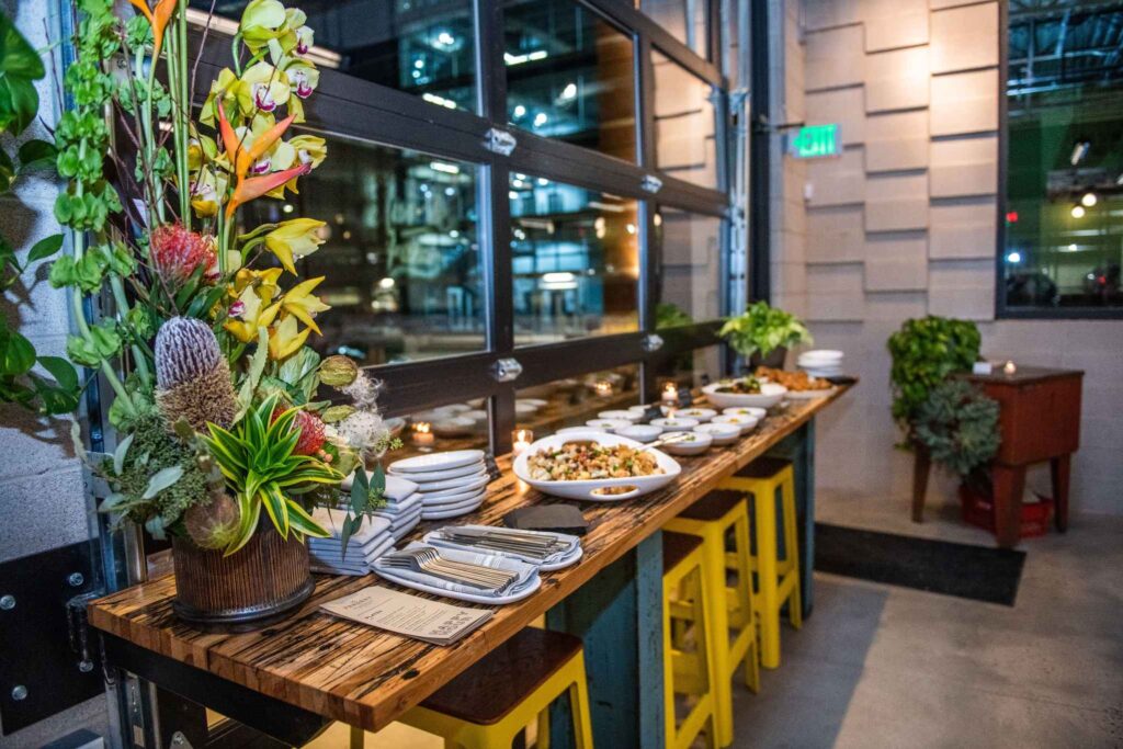 Upscale Dallas restaurant venue with florals and bar seating for events
