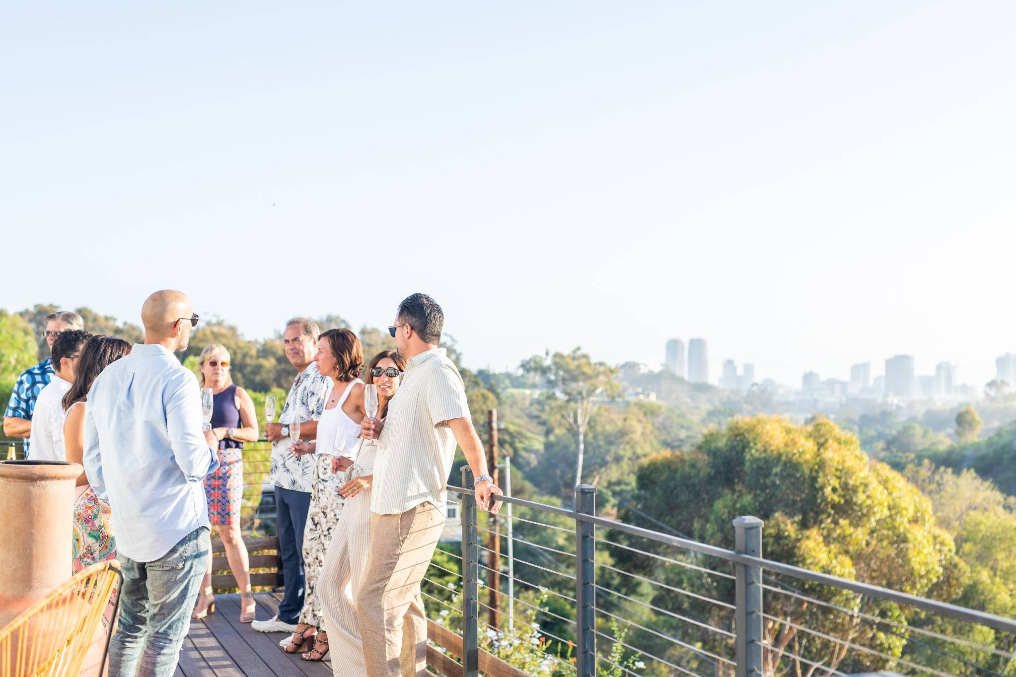 Group enjoying scenic overlook on outdoor deck for San Diego corporate retreat
