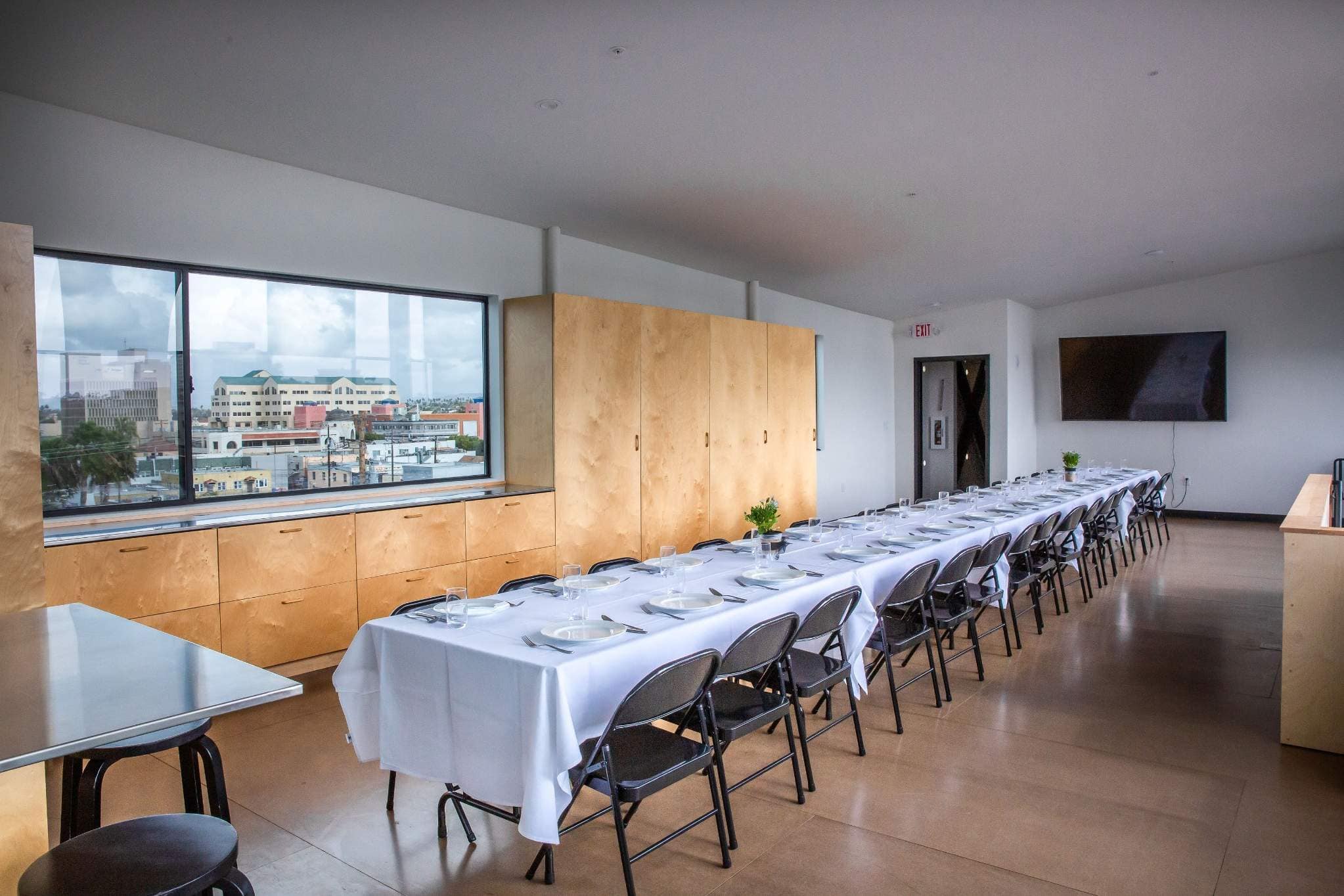 Modern private dining room with city views for San Diego corporate meetings