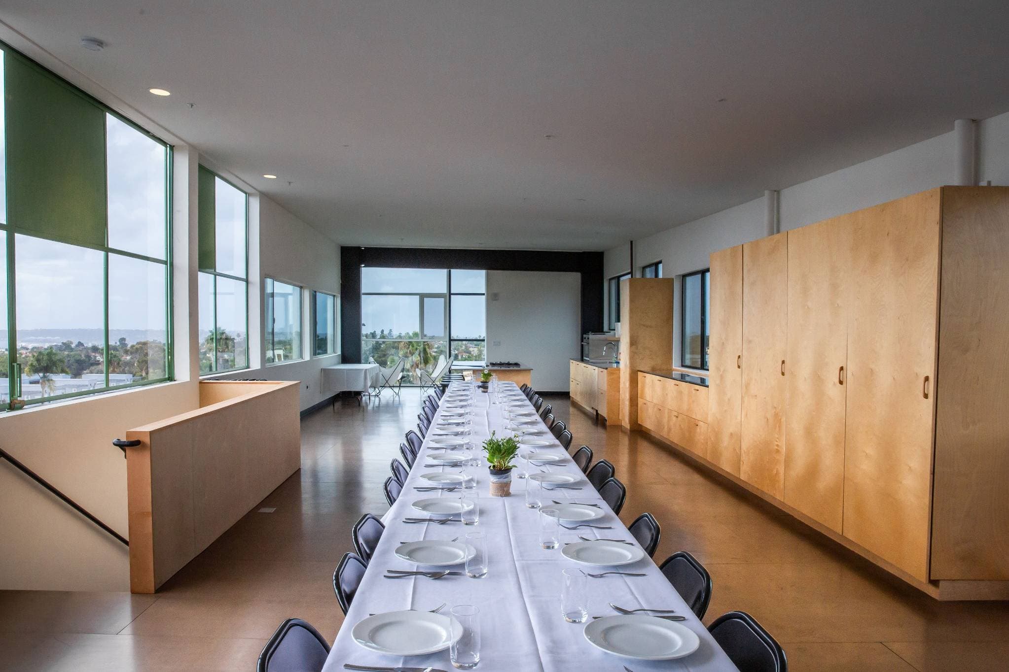 Sleek contemporary dining space with panoramic windows for San Diego corporate events