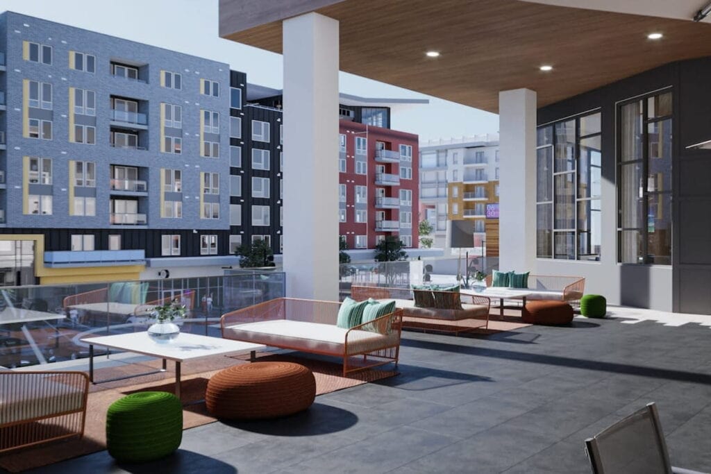 A rooftop area of a corporate-style building in a city area with multiple seating arrangements