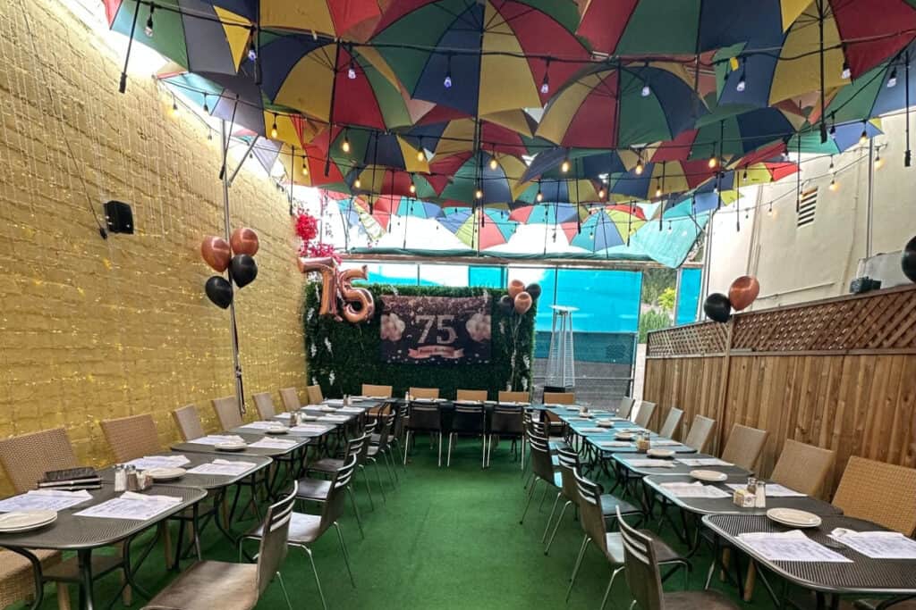 Umbrella Sky Restaurant Patio with Flower Wall