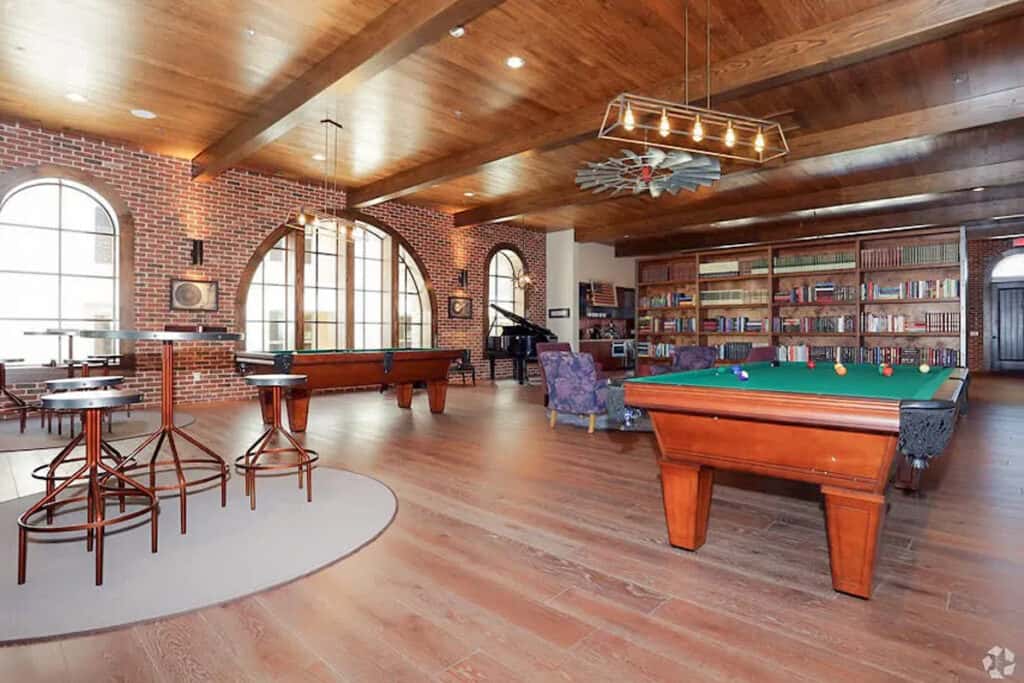 a club room with two pool tables