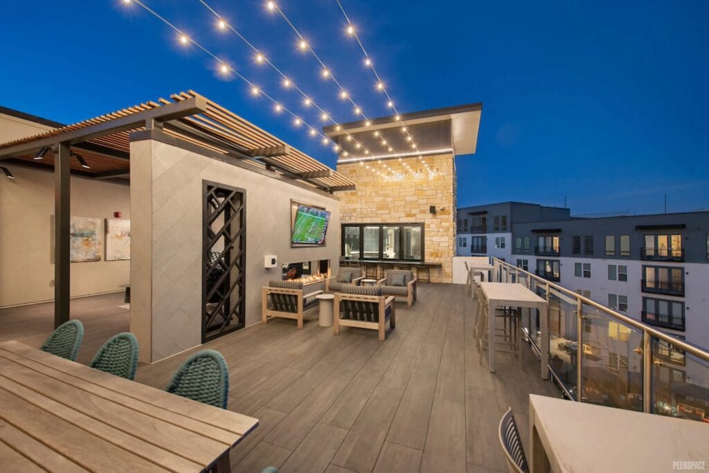 A Dallas rooftop glistens under twinkly lights