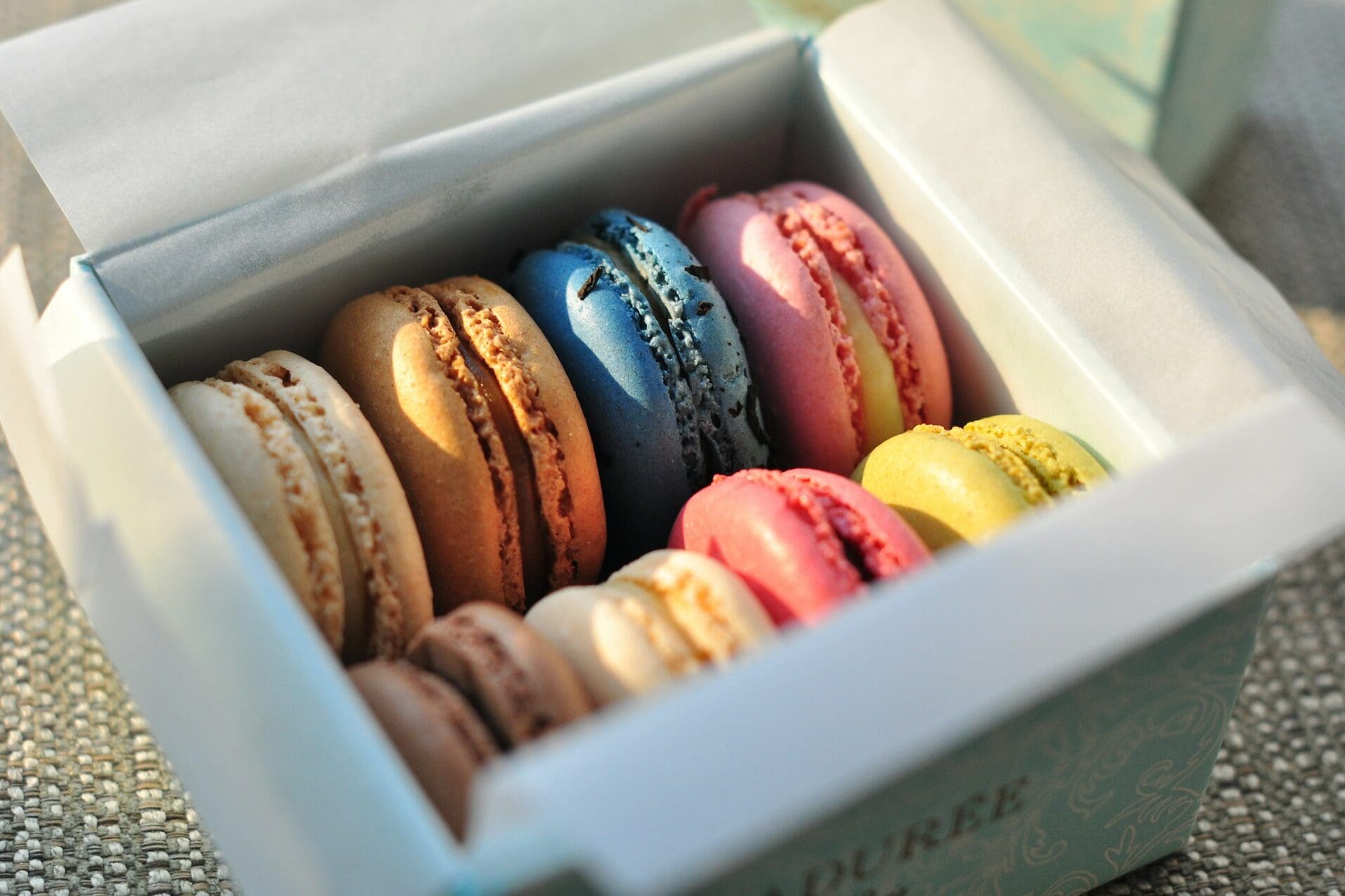 Box of colorful macarons as women's birthday gift idea