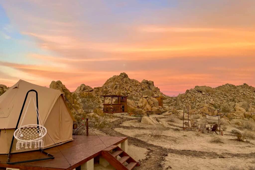 Desert hilltop glamping site with Joshua Tree landscape