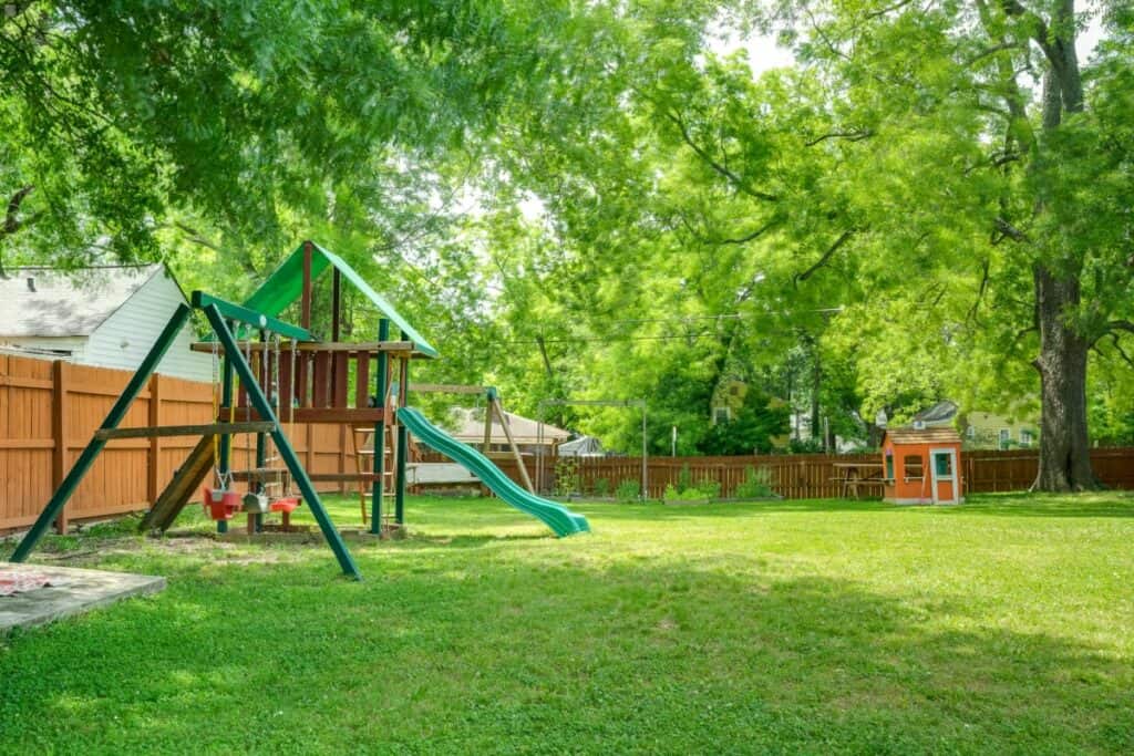 a large backyard with a playground