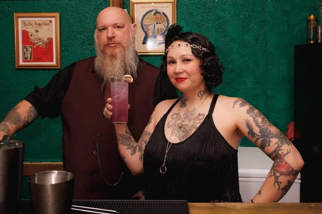 Bartenders stand by the bar at The Emerald Vine Room