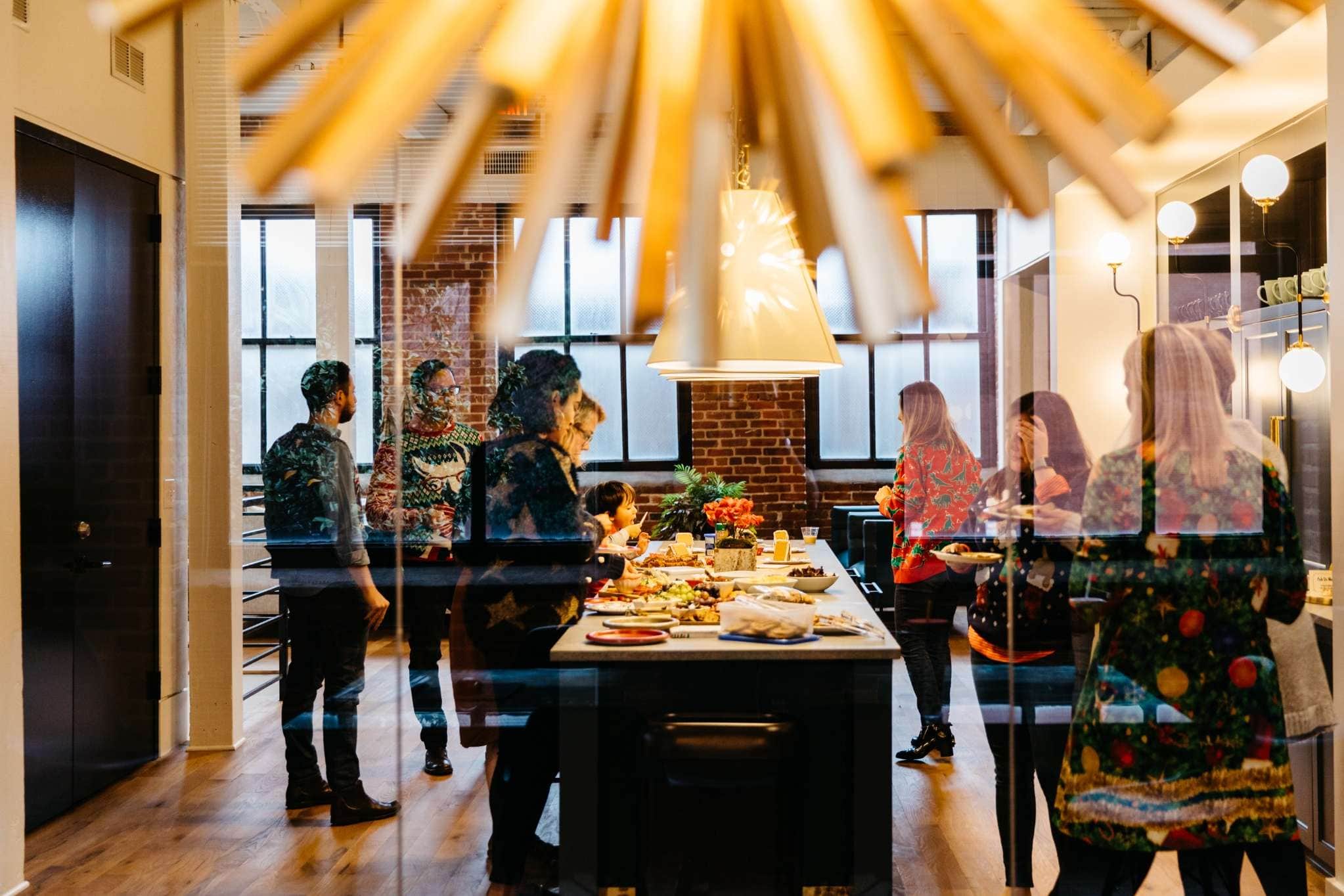 Festive Atlanta loft event with holiday food spread and guests