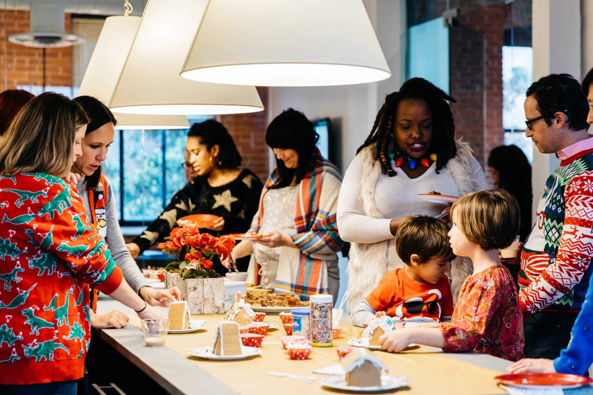 Atlanta holiday gathering with decorated table and festive sweaters