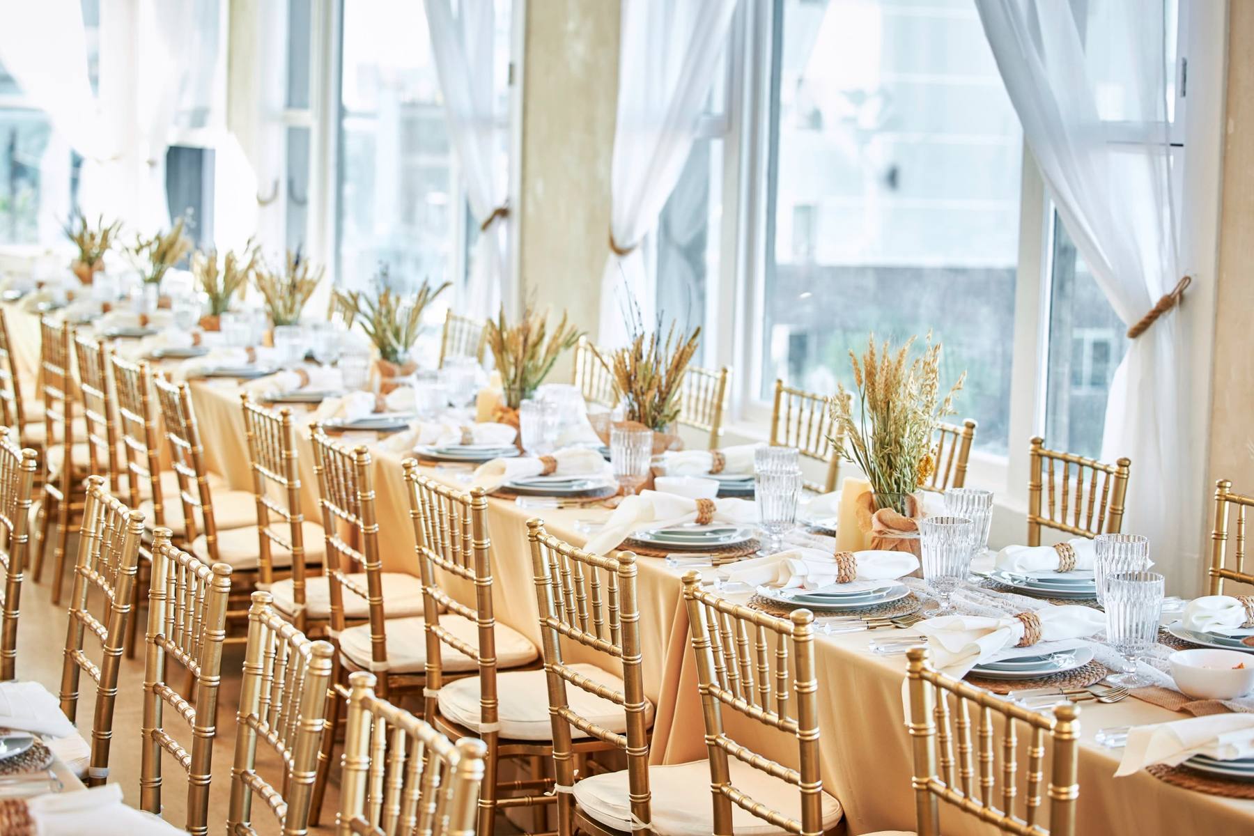 Elegant California banquet table with floral centerpieces and city view