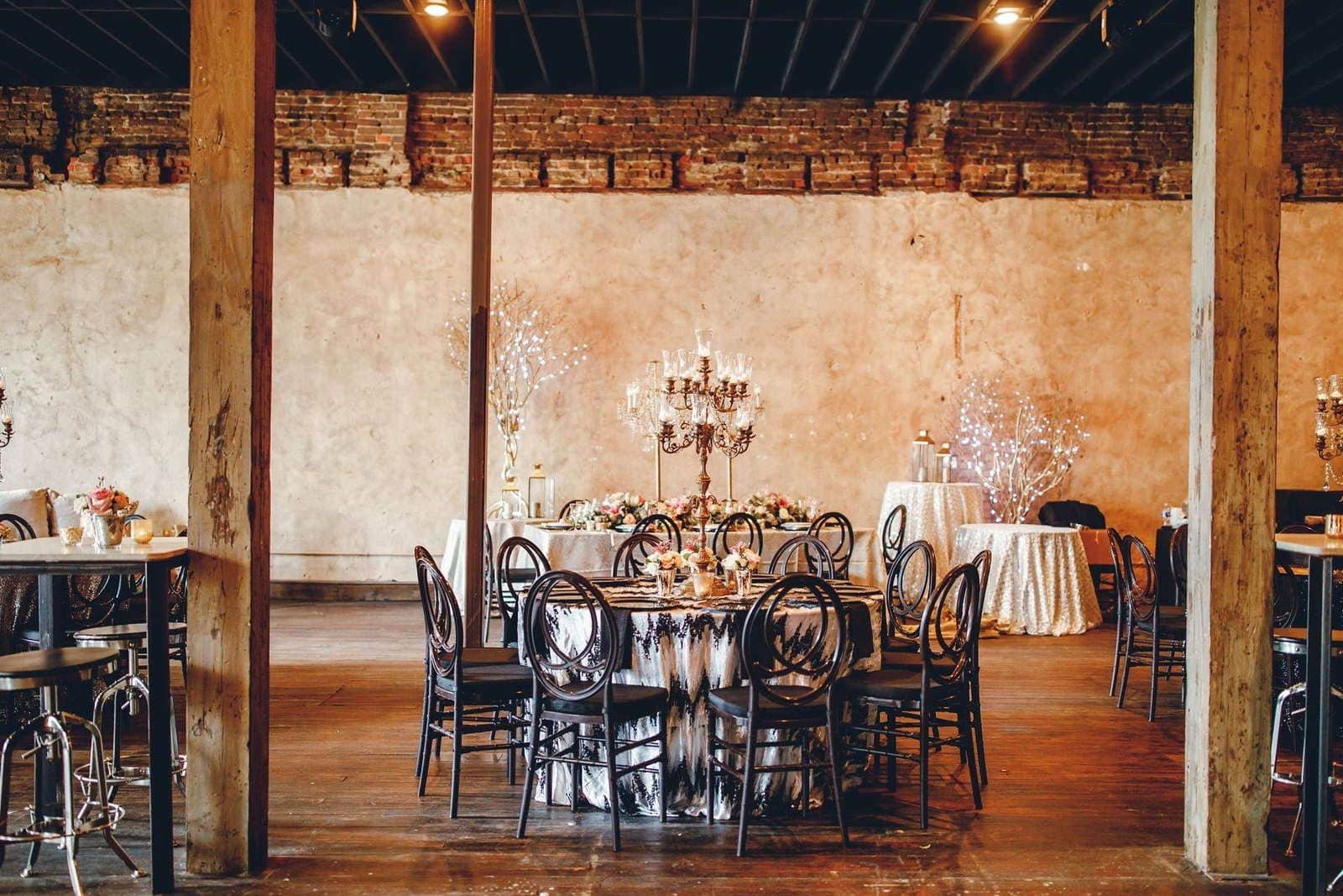 Styled Houston event space with refined tablescapes, candlelight, and floral design