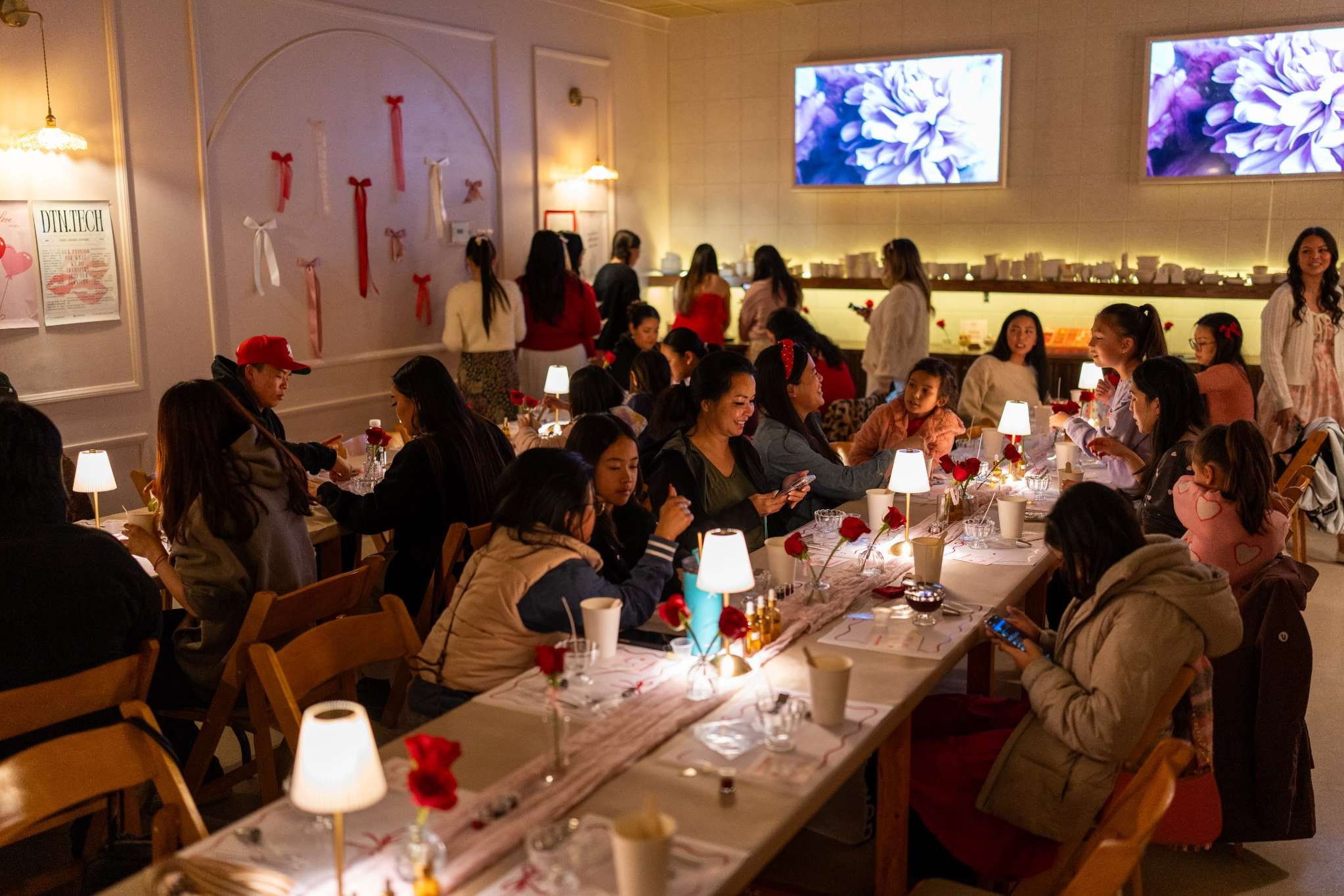 Guests mingling at a styled New Orleans event with floral table décor