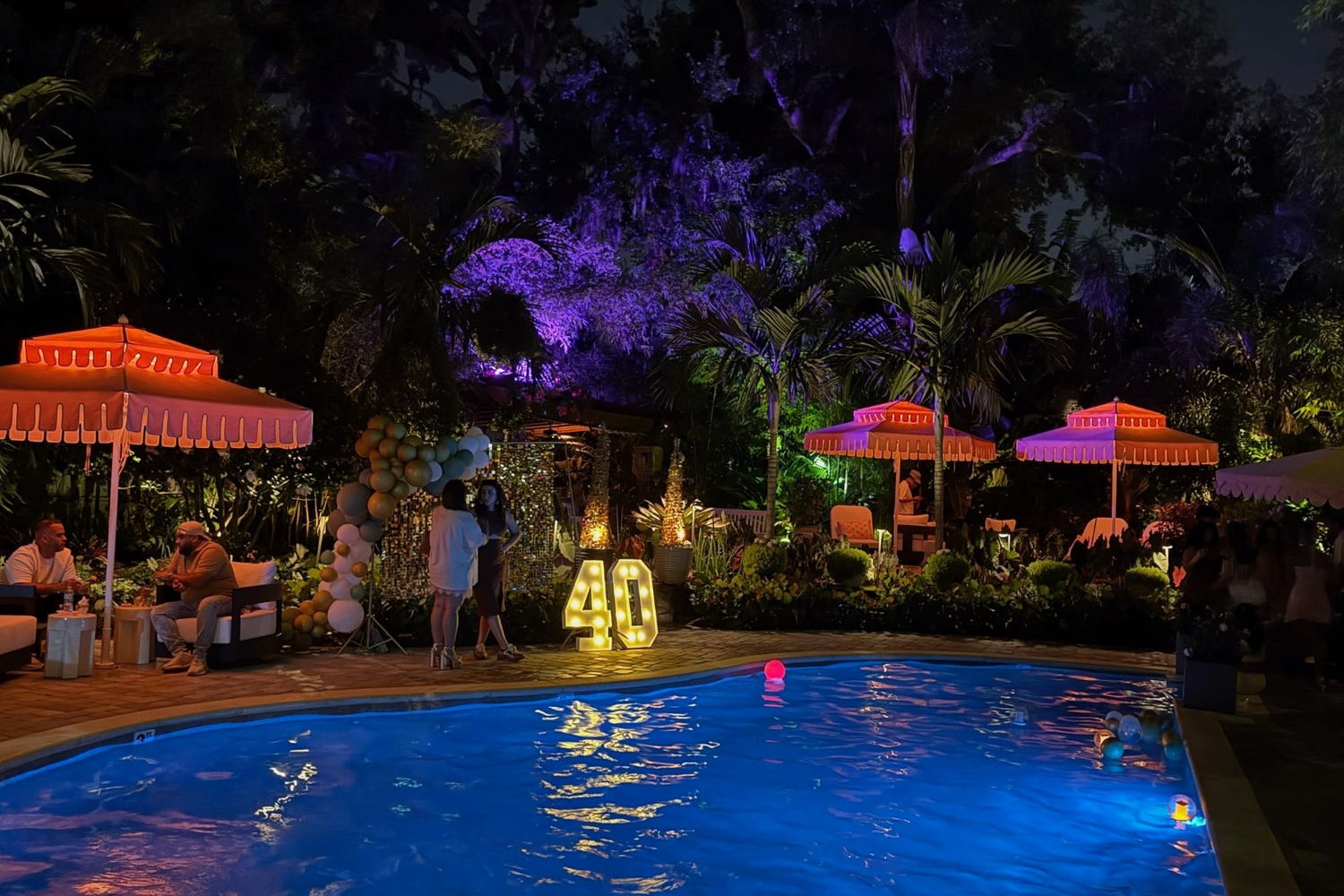Colorful nighttime poolside celebration styled by Orlando event planners