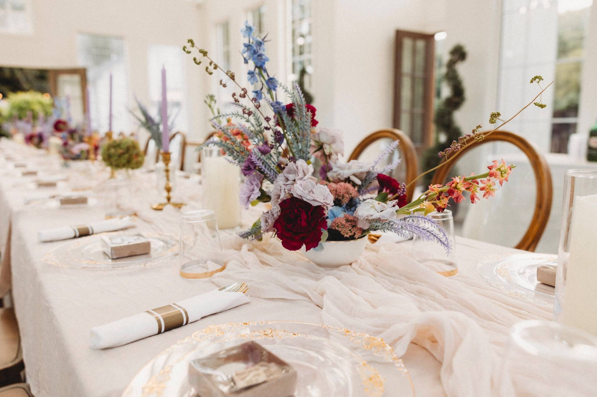 Elegant Orlando reception table with floral centerpieces and tulle runner