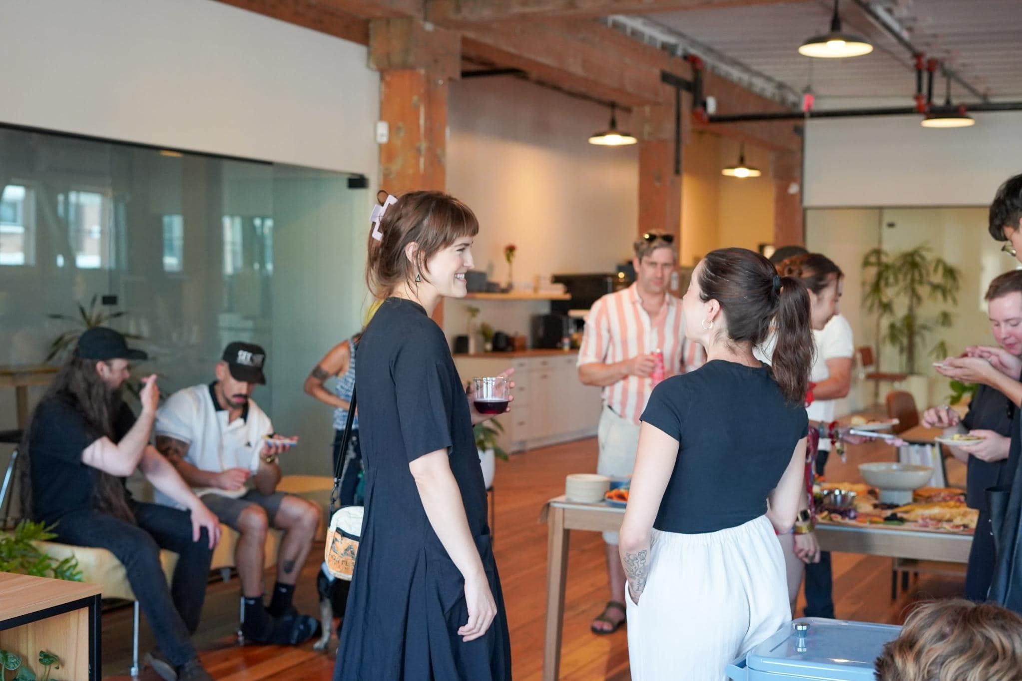 Guests socializing at a casual Portland loft networking event