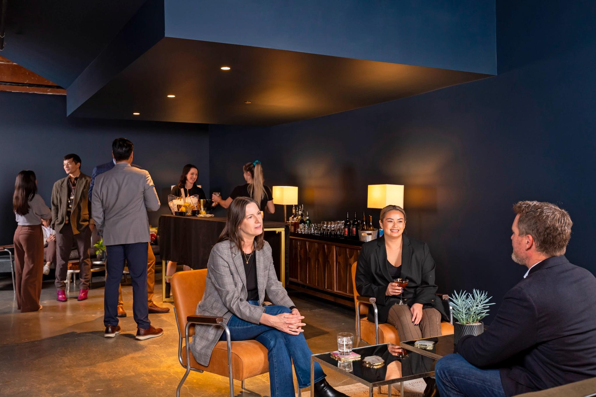 Upscale Seattle lounge event with guests networking in sophisticated setting