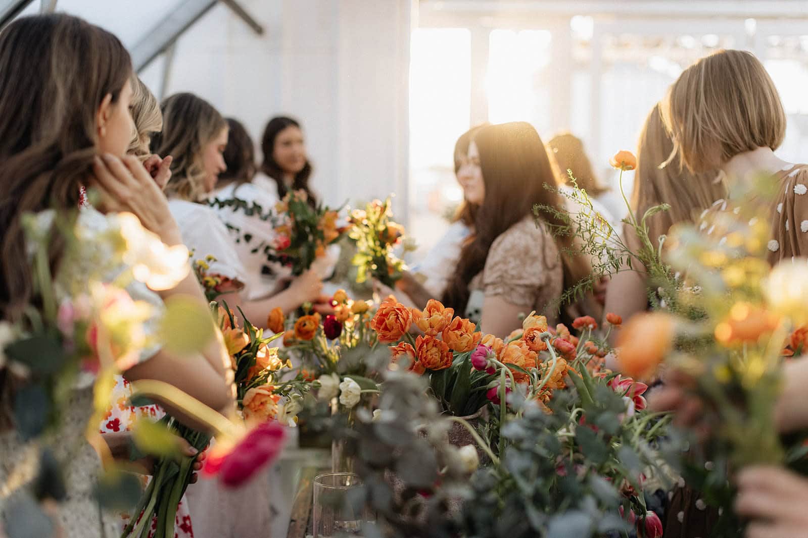 Women gathering with fresh flowers at Utah event planning workshop