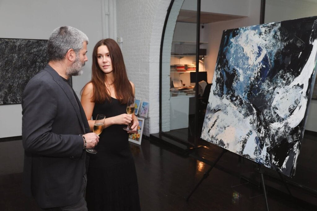 Two people at art studio event planned by Virginia event planner