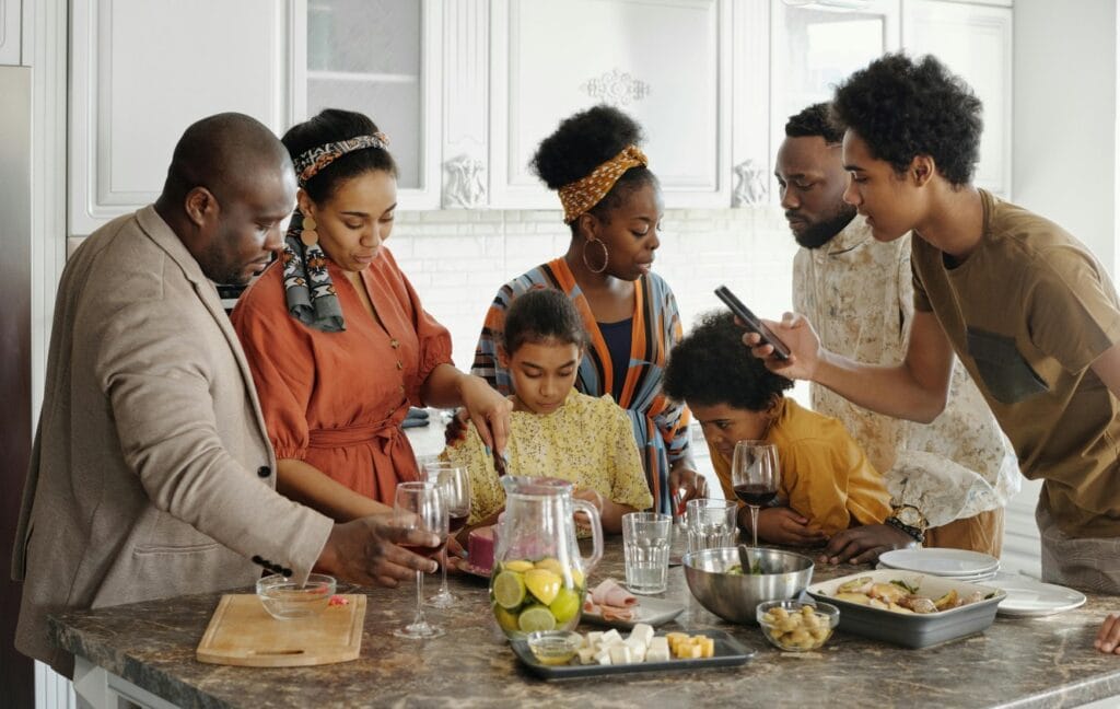 family gathered around a kitchen counter
