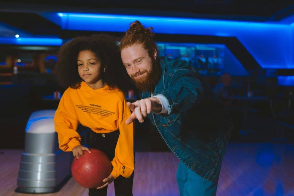 father and daughter bowling