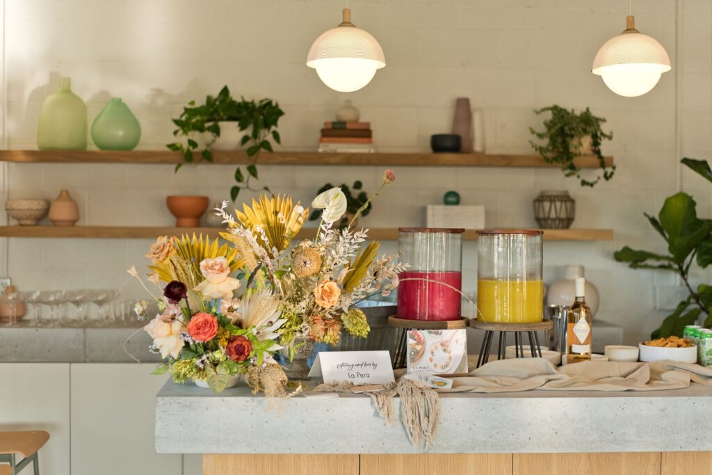 a table topped with flowers and juice