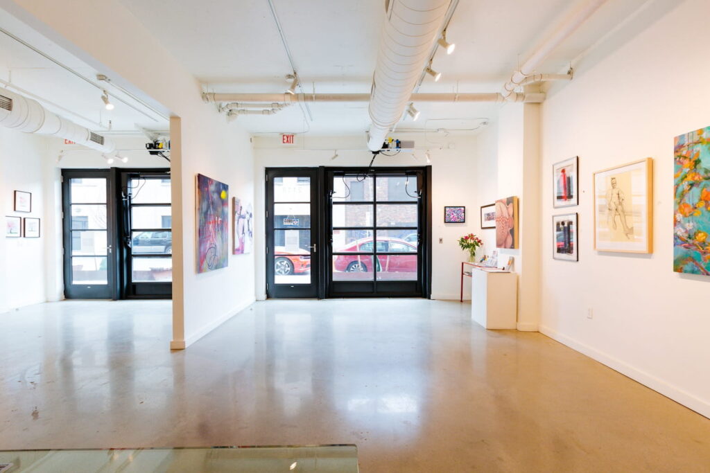 Black windows and doors punctuate an all-white gallery space in Washington, DC