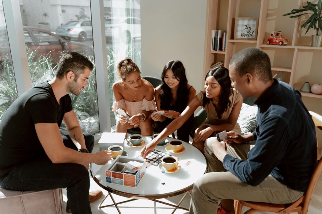 friends gathered around a board game