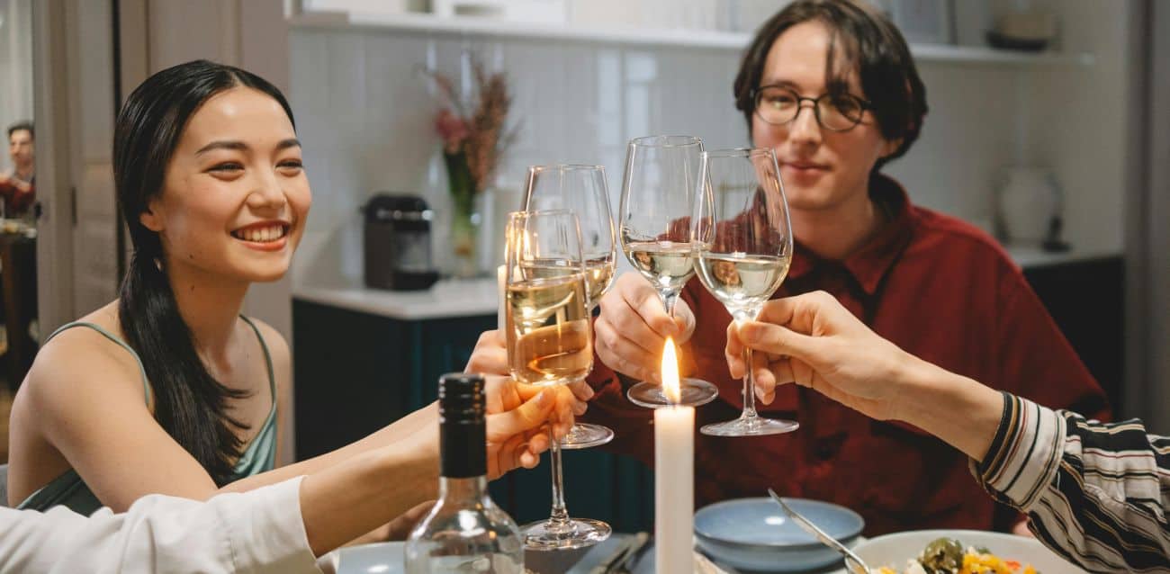 friends toasting at a dinner party