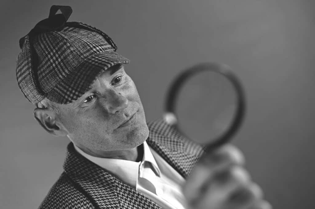 man dressed as detective clue game