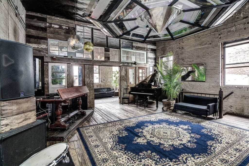 Wood accents, brick walls and large windows anchor a warm event space in Brooklyn