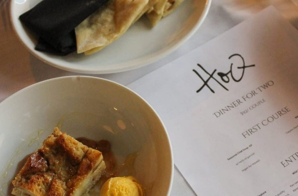 Close up shot of two dishes and a menu at HoQ in Des Moines