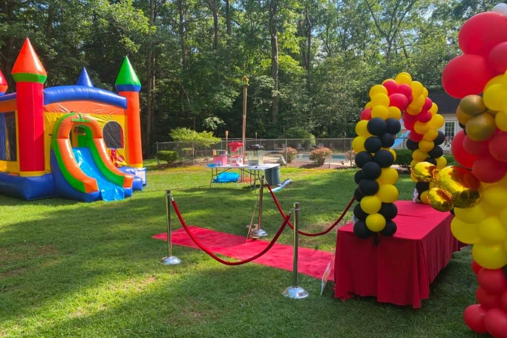 a hughesville backyard with a pool and bounce castle