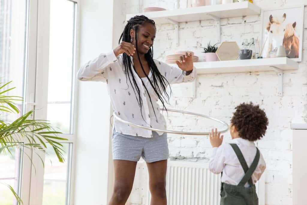 a mom hula hooping with her son