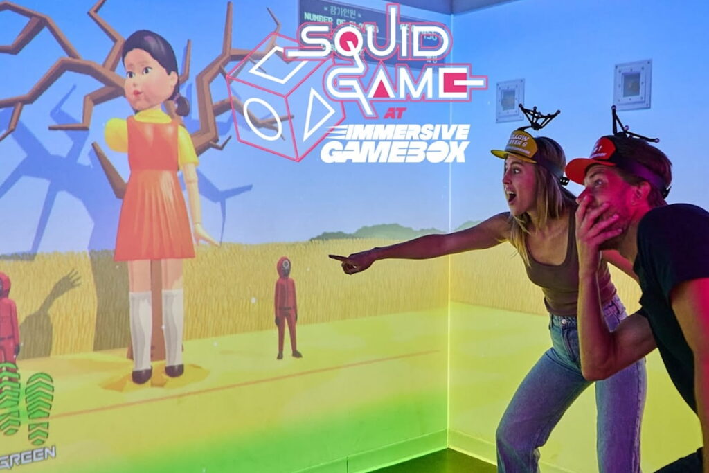 Two people participate in an immersive gaming experience