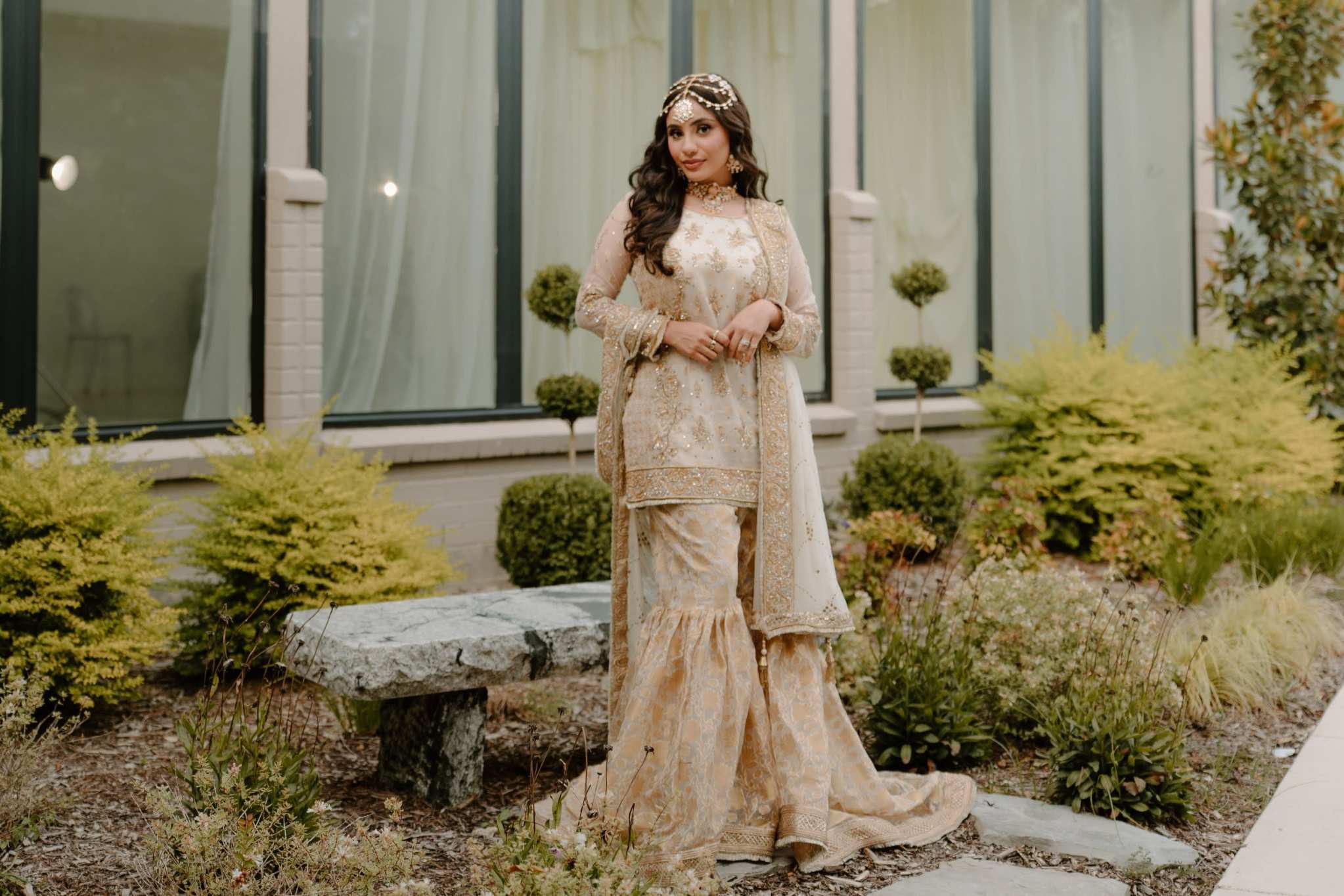 Woman in ornate South Asian formalwear at contemporary California venue