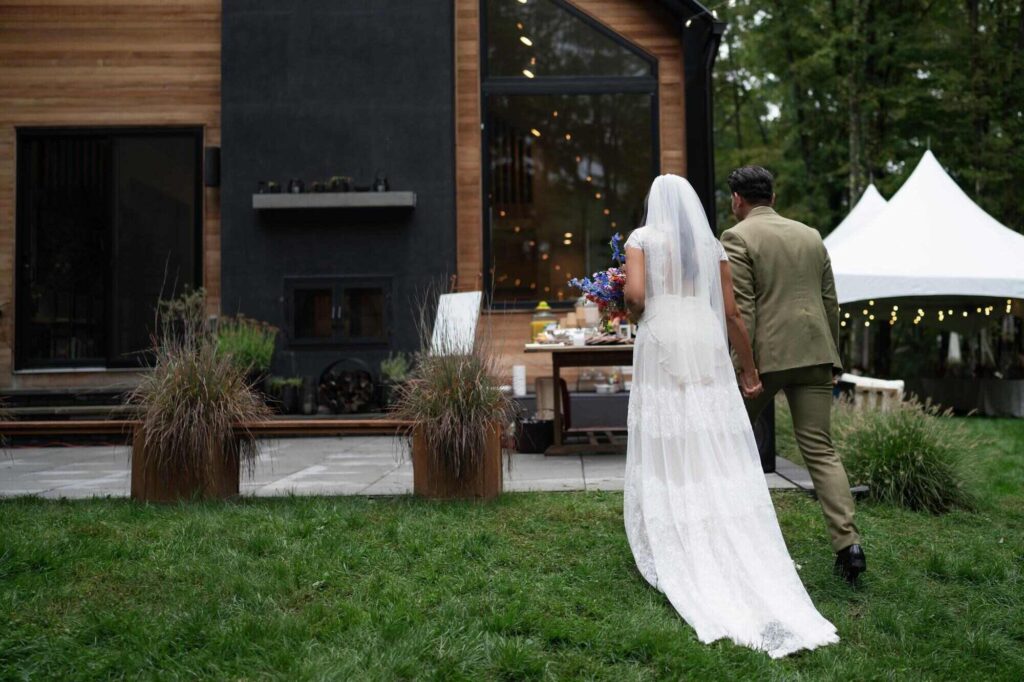 Bride and groom walking into New York benue