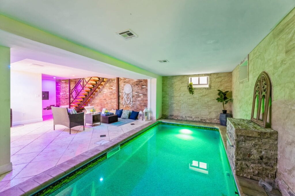 Indoor pool in the basement of a stone home