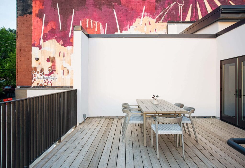 Intimate urban rooftop with table and chairs