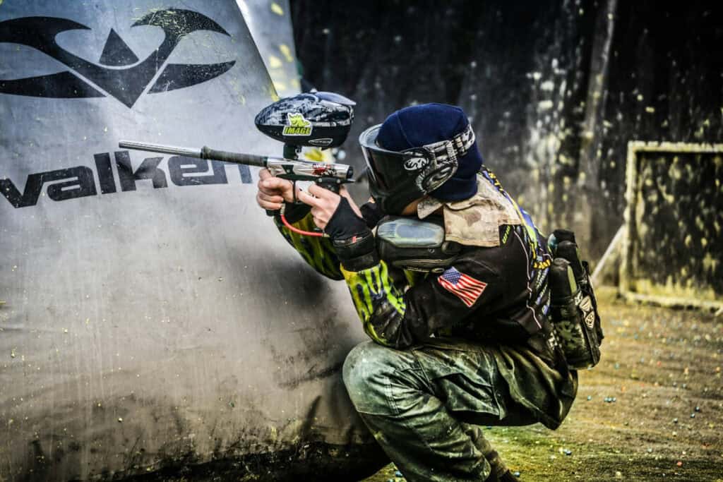 man playing paintball outside