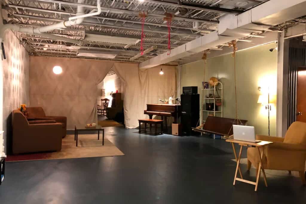 a production warehouse with chairs and a sofa