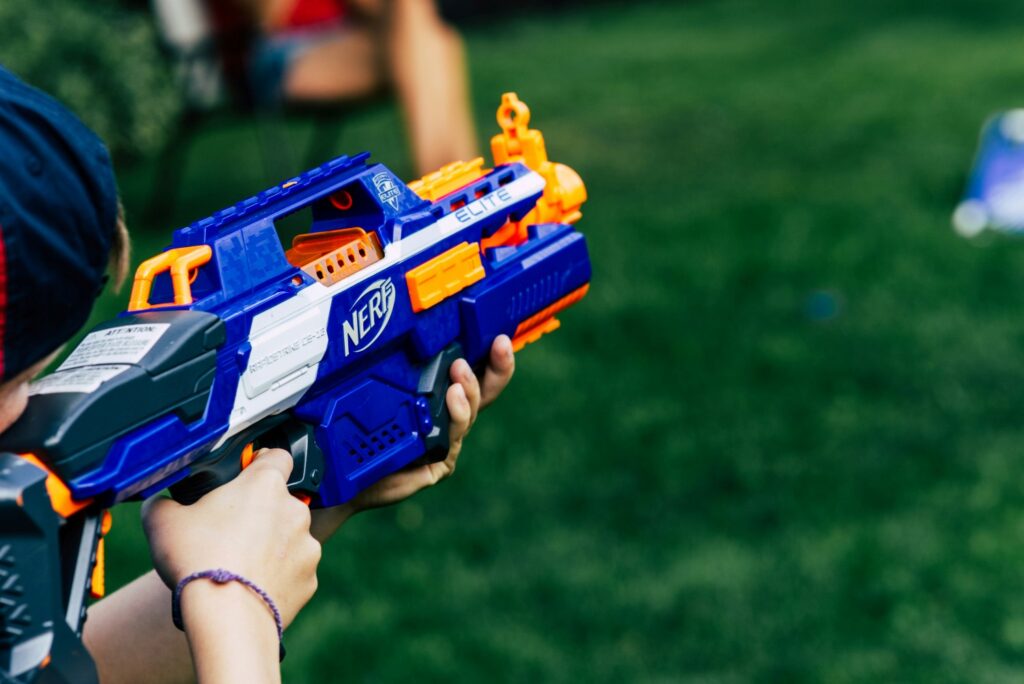 kid holding blue nerf gun