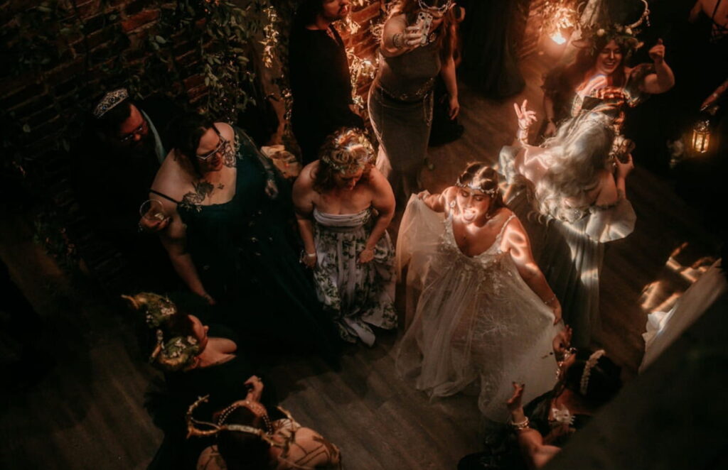 A dance floor full of women in gowns, shot from above