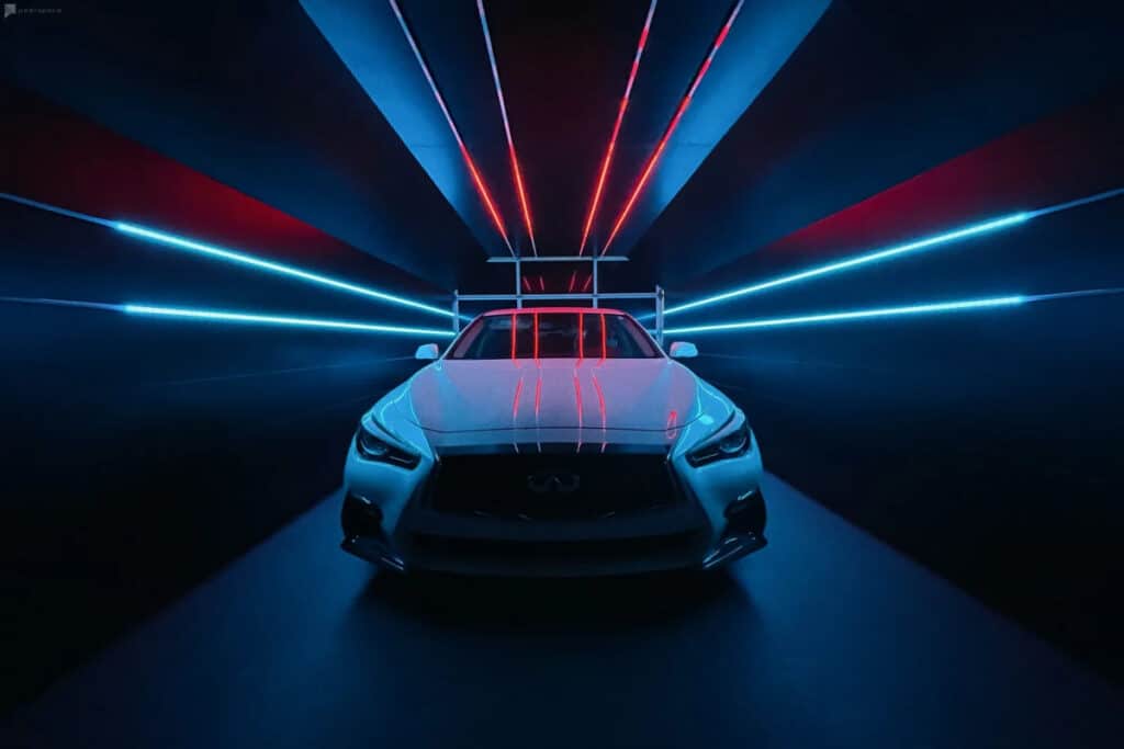 A neon-lit studio space with a car