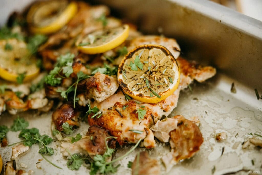 Close up of a tray of lemon-garnished entrees